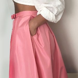 Pink skirt with pockets bow detail pleated party